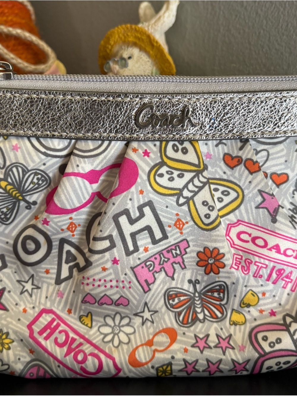 Coach Poppy y2k butterfly graffiti wristlet